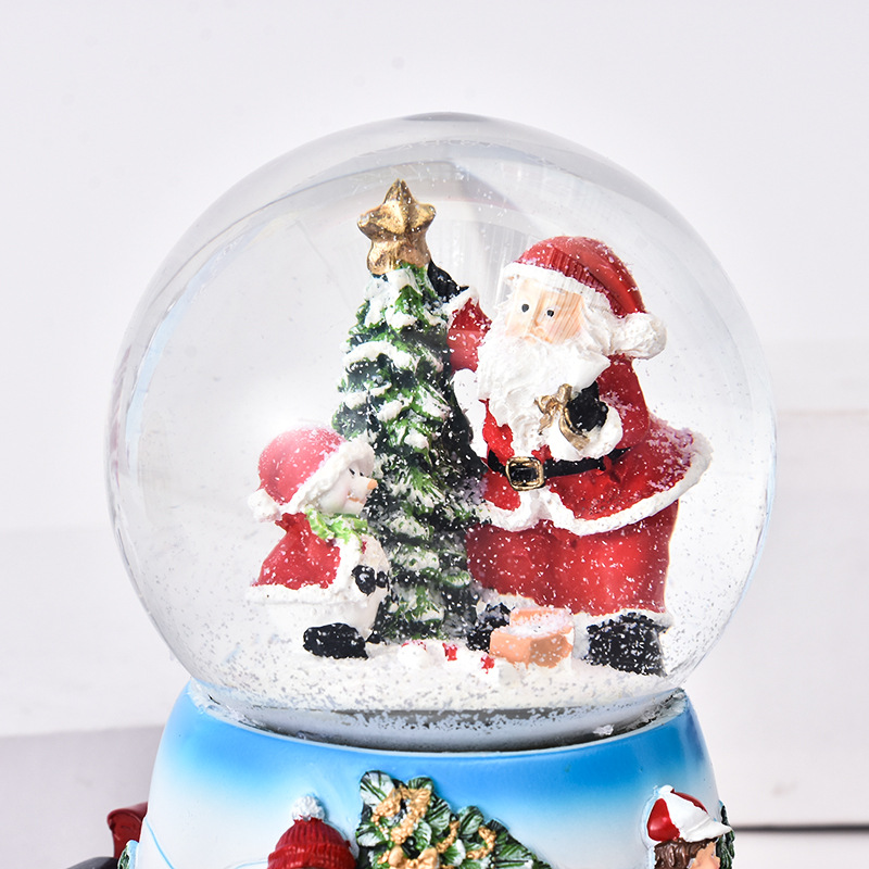 Handgemachte kundenspezifische Polyresin Santa Claus Musikalische Weihnachtsschneekugel mit drehbarer Basis